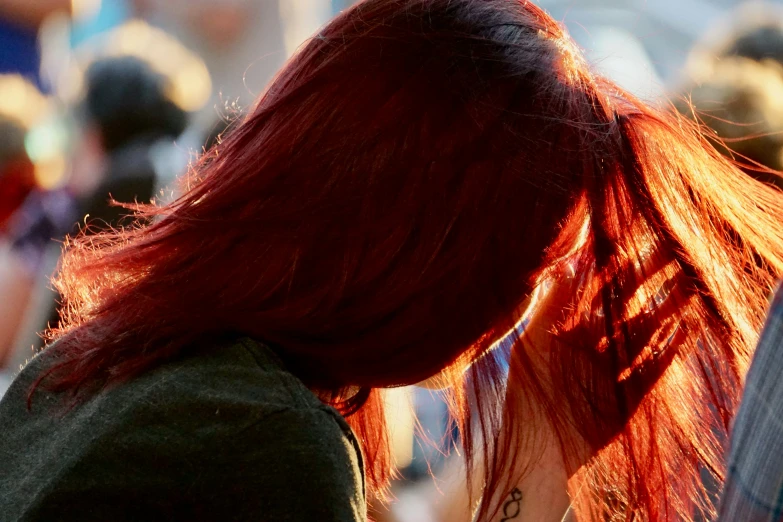 a woman with a red hair is holding a knife