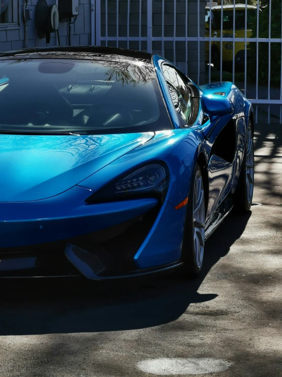 a car is sitting on the street with its hood open