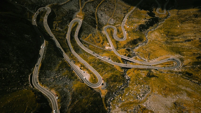 a group of curves on top of a hill in the dark