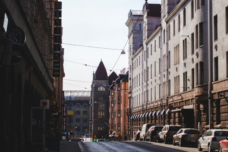 a city street filled with lots of tall buildings