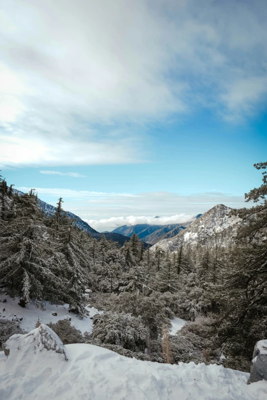 a view from a snowy mountain top with some skis