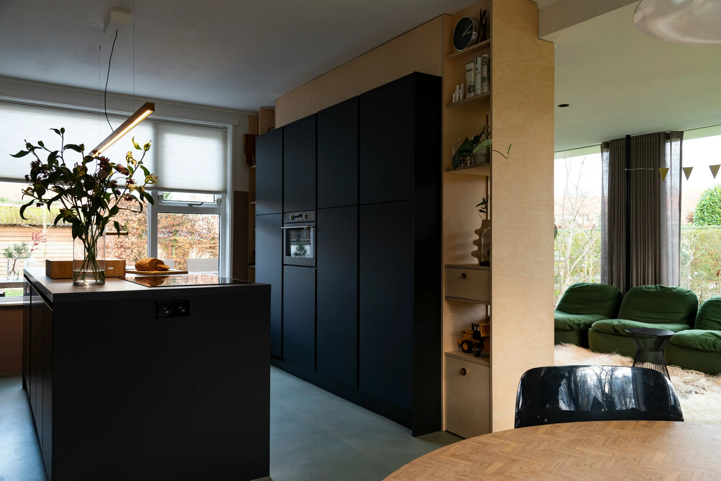 the kitchen has an island counter and cabinets in it