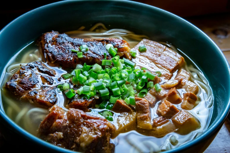 an asian dish consisting of meat, broth and noodles