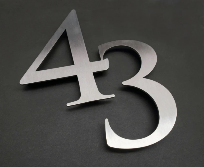 an image of a number three metal sign