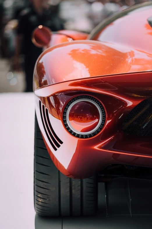 a close up of the front grille of a red sports car
