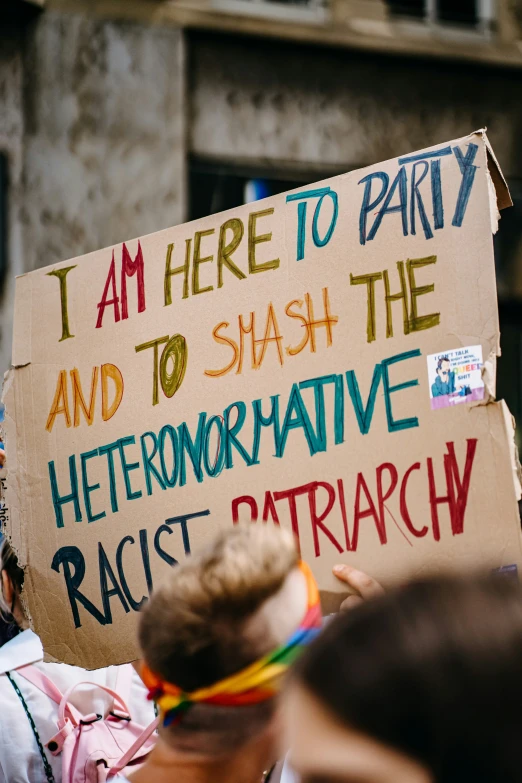 a protest sign at an anti - gay rally
