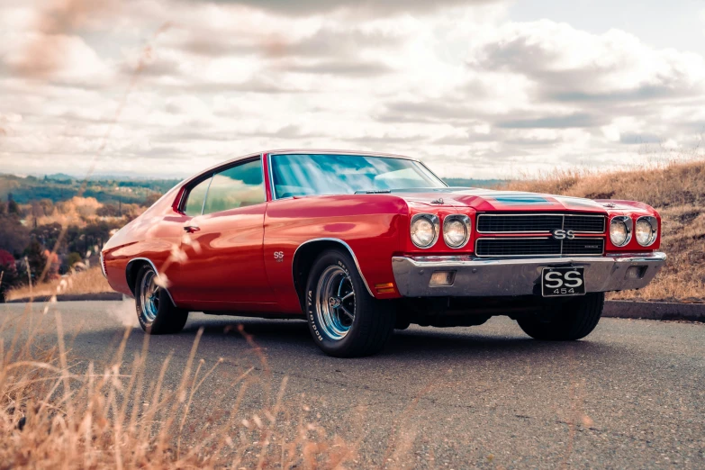 this old muscle car was parked on the side of the road