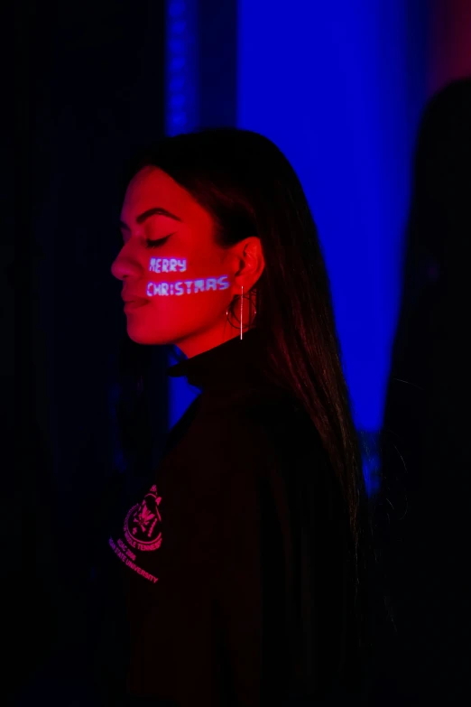 a woman with red paint on her face