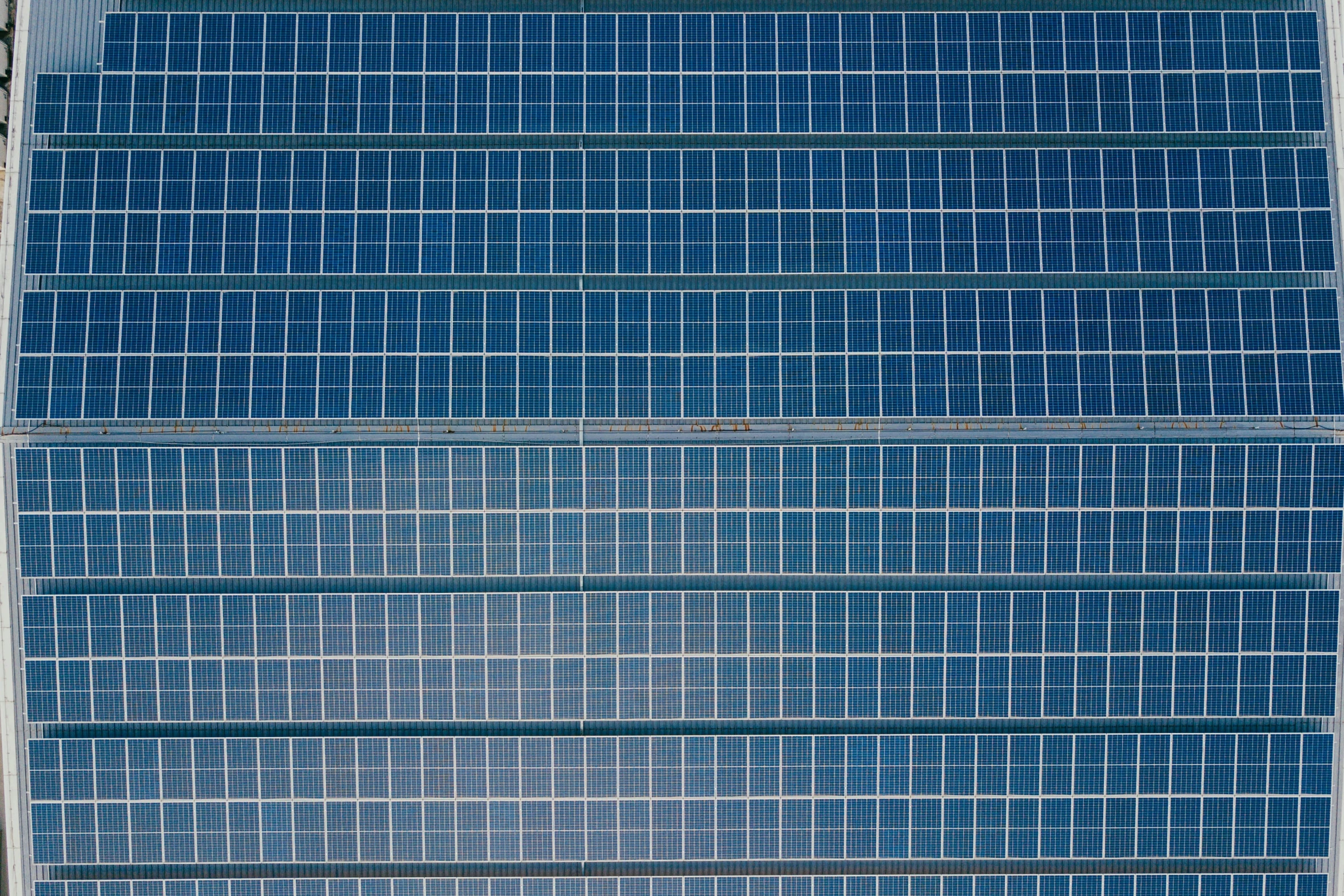 blue and white windows that are on the side of a building