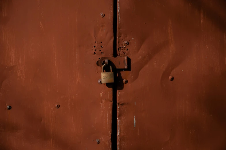 a door with a lock, showing the rivet holes