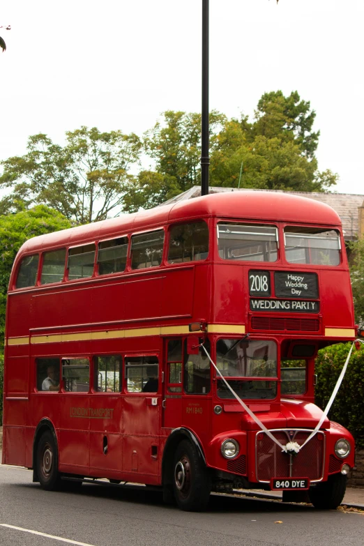 a double deck tour bus with passengers in london