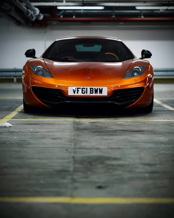 a very pretty car in a parking garage