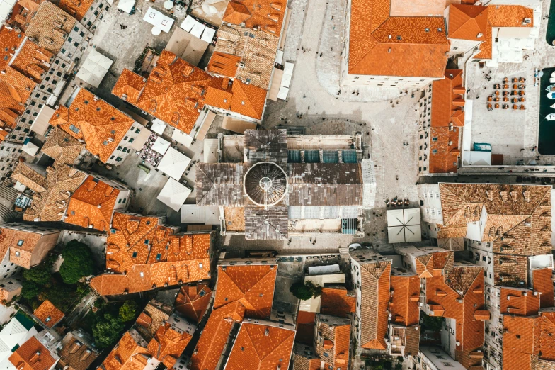 an aerial view of a residential area with orange tiles