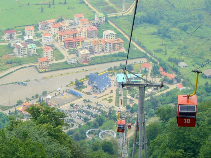 a cable car is going through a green valley