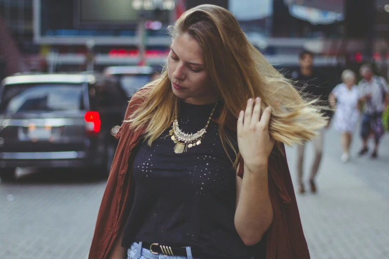 a woman on the street is talking to her hand