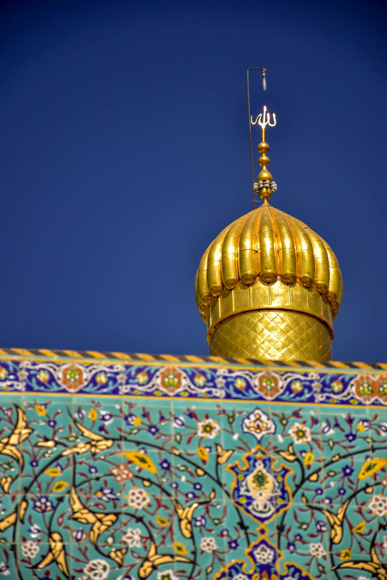 a shiny gold roof of an ornate building