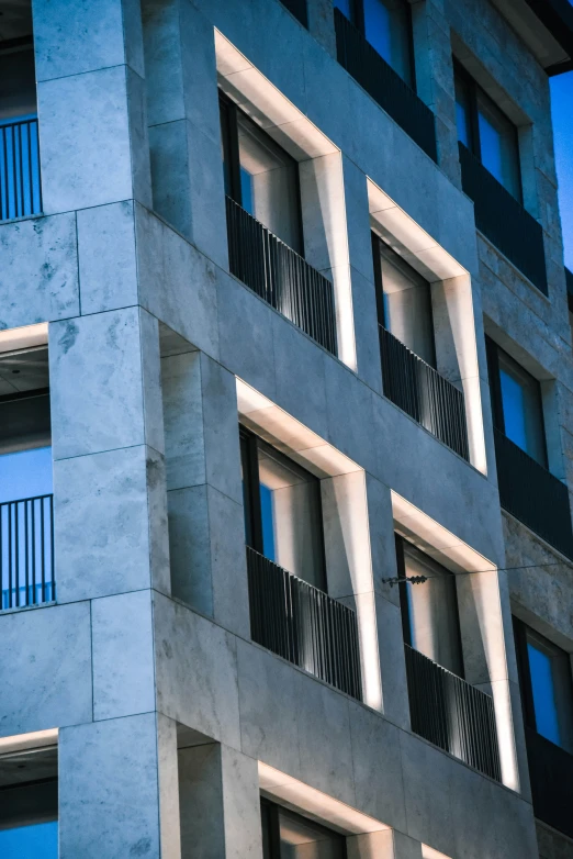 a tall building with lots of windows next to it