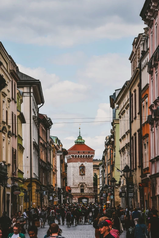 people are walking down an empty city street