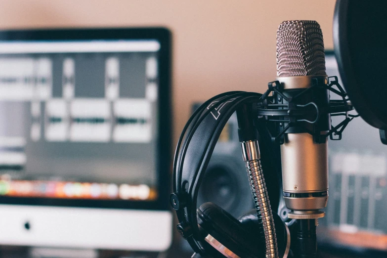 an earphone resting on top of a microphone