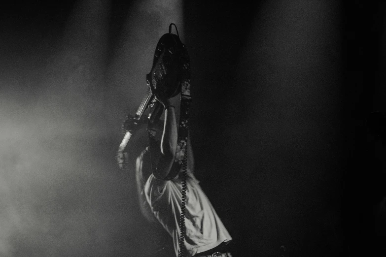 a person jumping up in the air holding a basketball