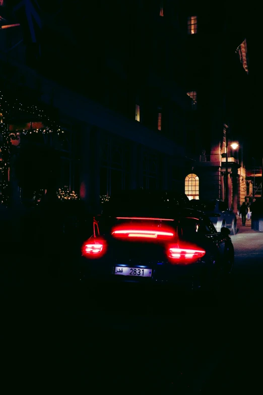 a car is shown with red lights as it passes