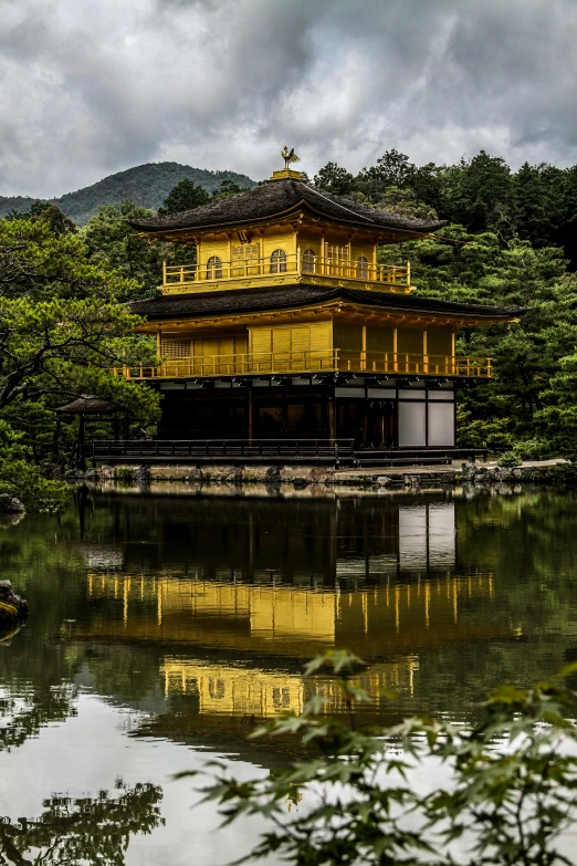 a large building in the middle of the forest