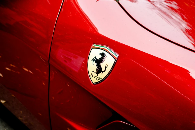 the emblem on a red ferrari sports car