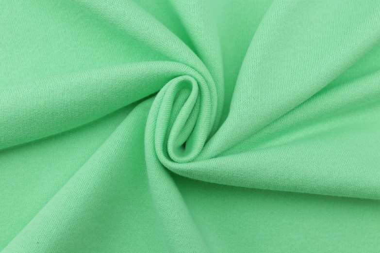 a bright green plain fabric background