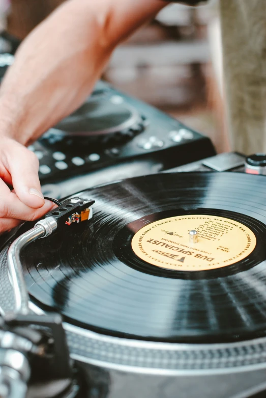 someone using a record player on a stage