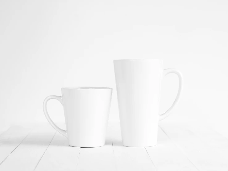 two cups are lined up in the same row