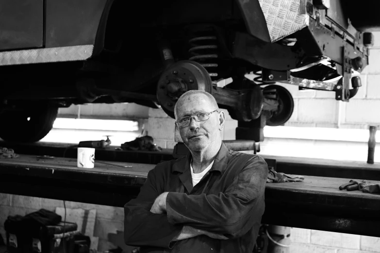 a man standing in front of a car