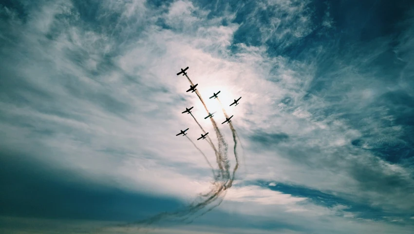 airplanes leaving trails in the sky