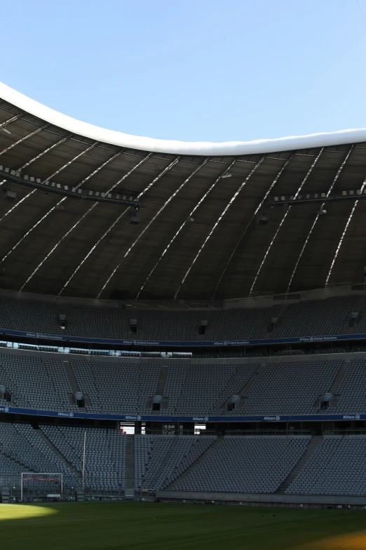 a po looking out the side of a large sports stadium