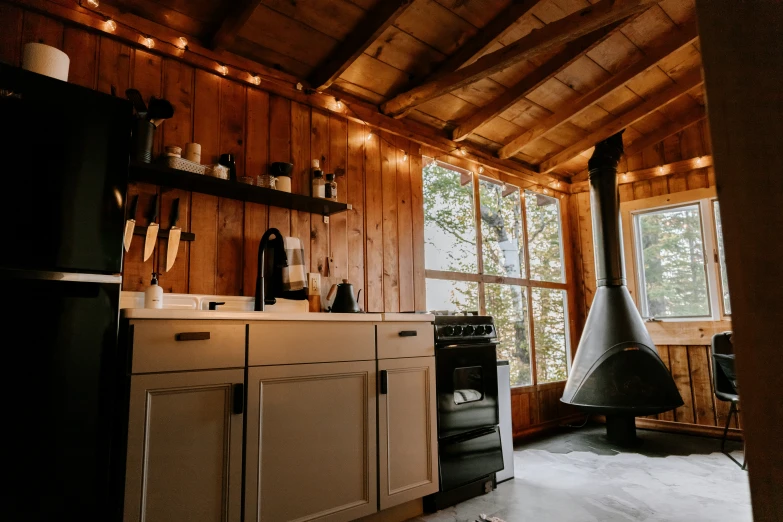 there is a fireplace in the kitchen next to a window