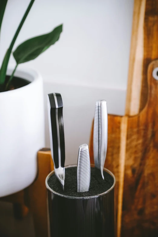 this is a set of knives that are on the wooden table