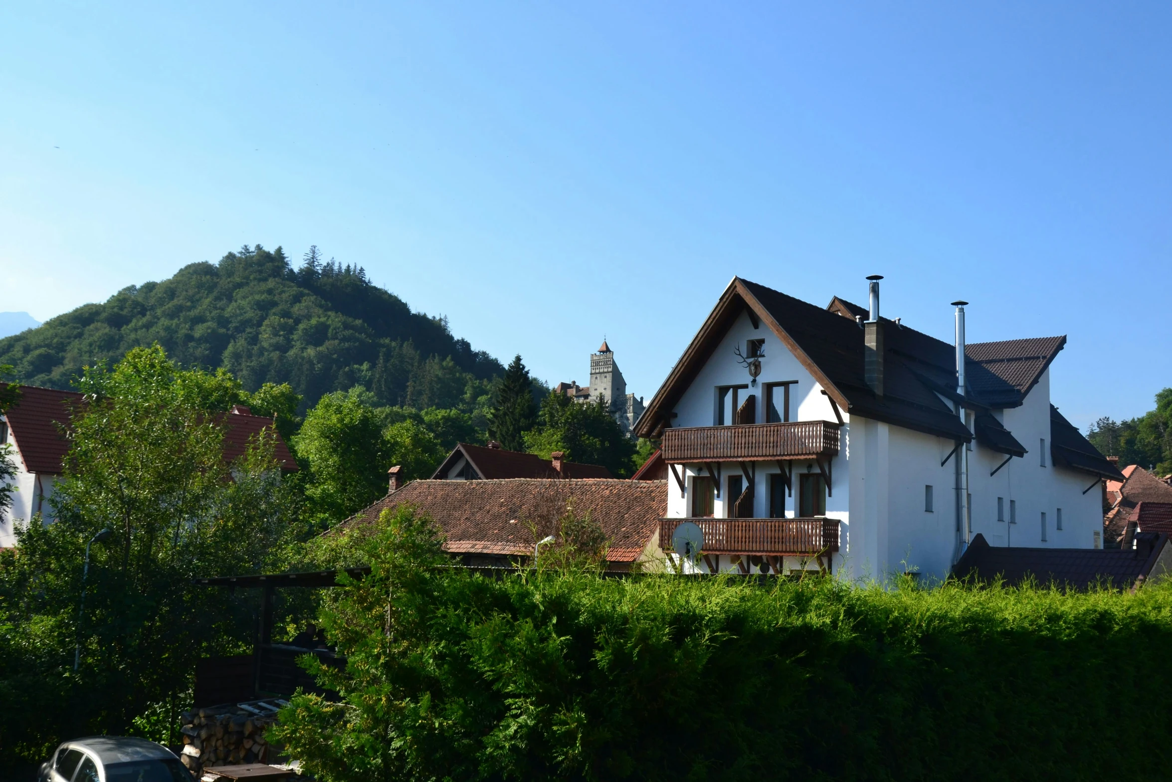 the house is located on the top of a mountain side