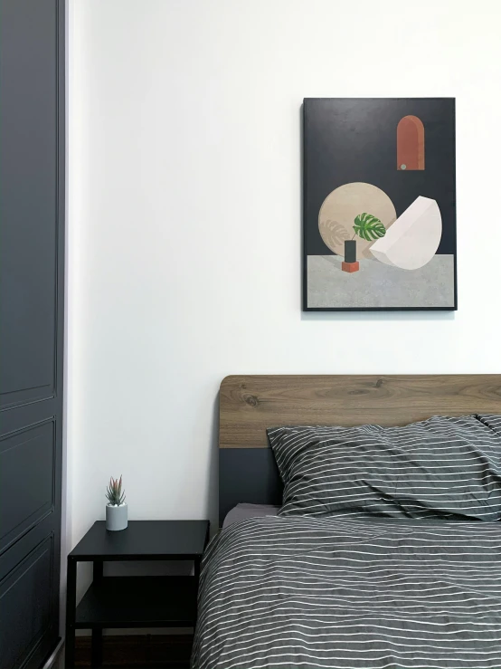 a minimalistic style bedroom, with an artwork on the wall
