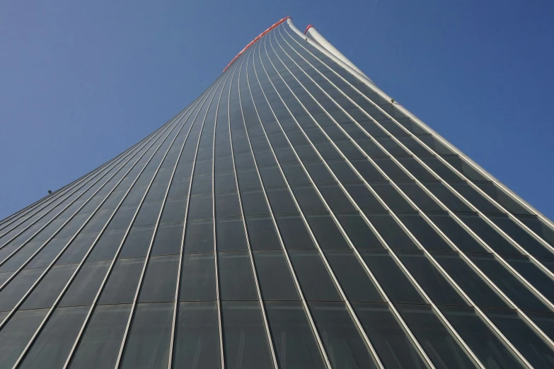 a very tall building towering over the city