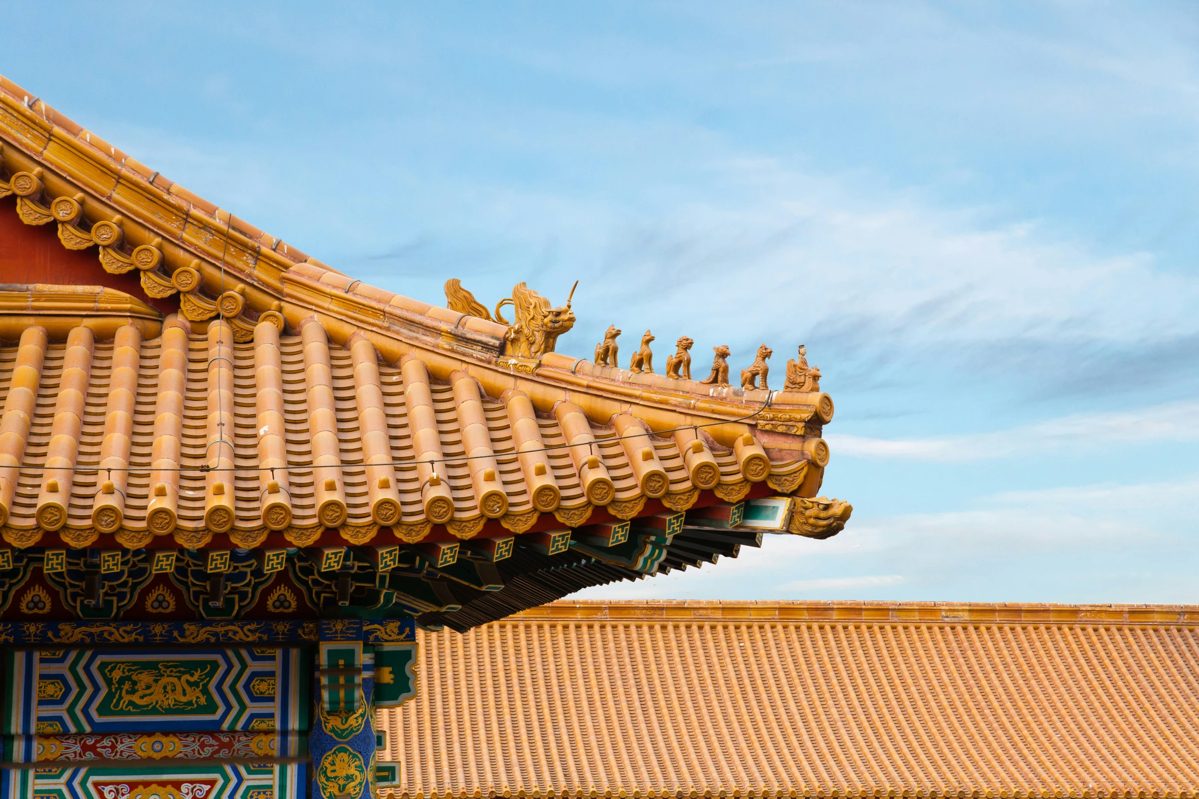 the roof of a chinese building under a clear sky