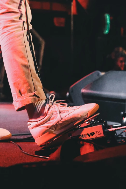 a man standing on top of a skateboard