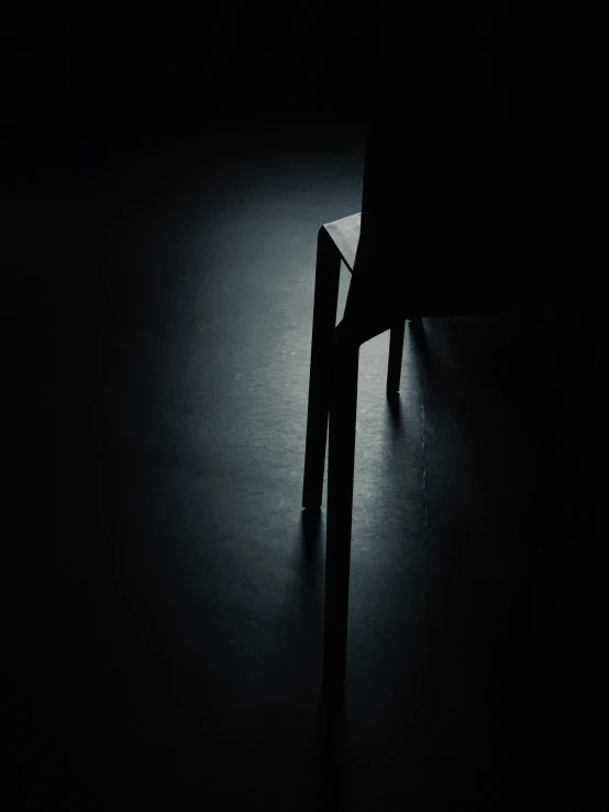 a dark po with a wooden bench next to it