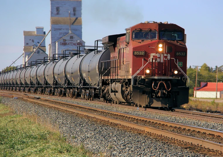 a train is on the tracks near a city