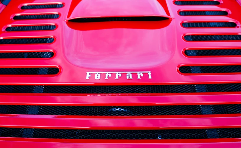 close up of the emblem on a large sports car