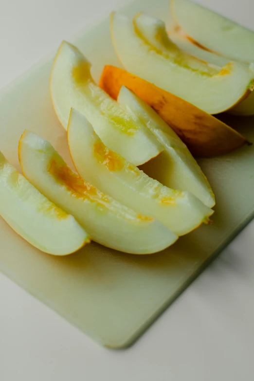 slices of apple with a  board and knife