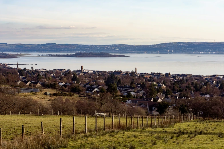 the view of the town of a city sits over a hillside