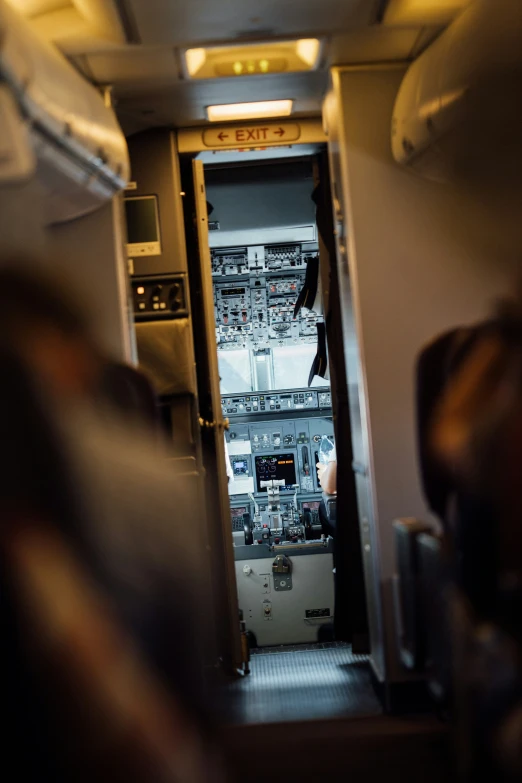 inside a cabin on an airplane with many wires and controls