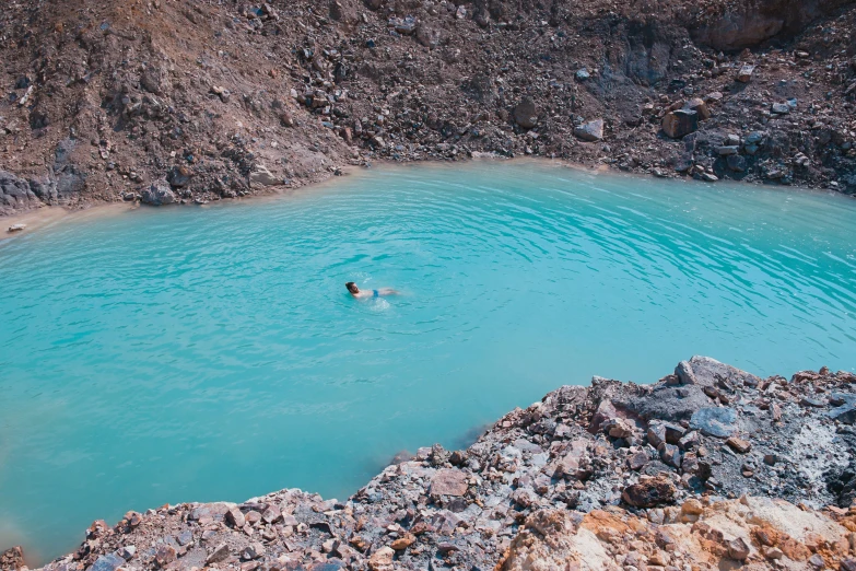 a man swimming in a body of water