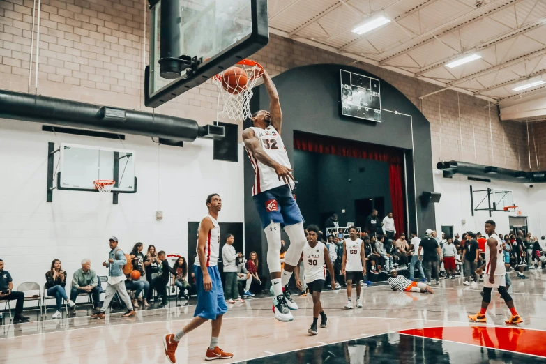 an image of a man jumping up for the basketball