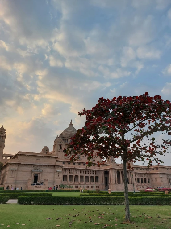 the beautiful building is built with statues and gardens