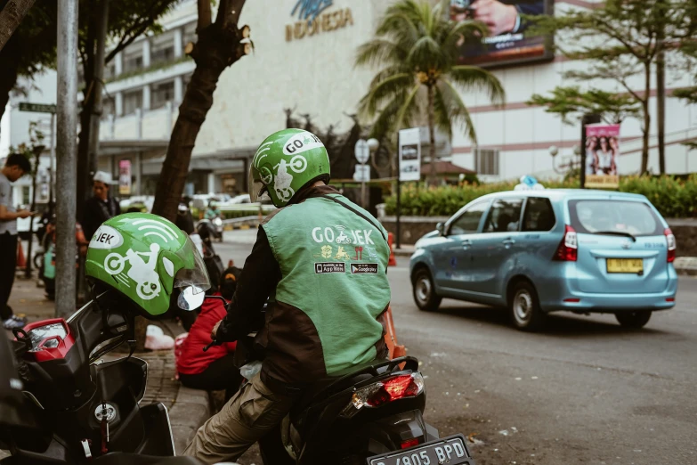 two people with helmets are riding their motorcycle